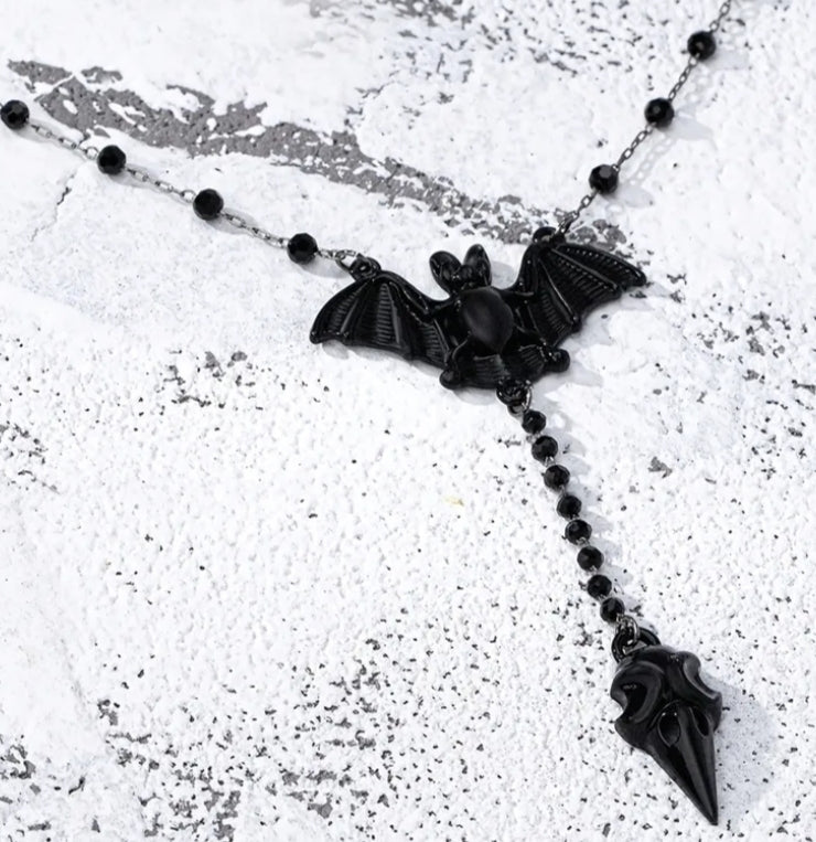 A Stylish Y - Shaped Necklace Featuring a Gothic Black Bat,