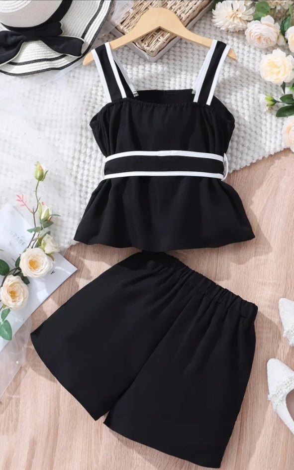 A Set of Two Pieces for Girls Consisting of a Black Tank Top with White Straps And a Belt Design