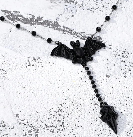 A Stylish Y - Shaped Necklace Featuring a Gothic Black Bat,
