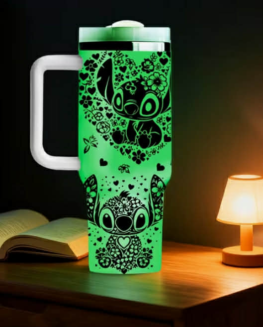 A 40Oz Stainless Steel Night Glow Water Cup Featuring a Disney Stitch Pattern, Equipped with a Handle.
