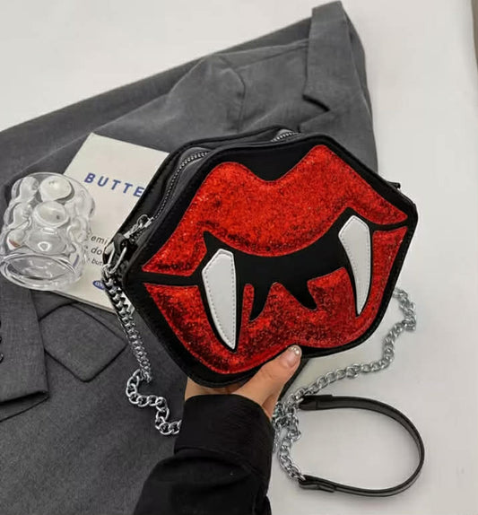 A Crossbody Bag Designed Like Vampire Lips, Featuring a Gothic Style with a Creative Chain. This Novelty Zipper Satchel