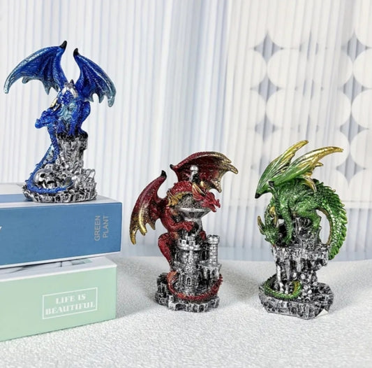 Medium-Sized Intricately Carved And Hand-Painted Guardian Dragon Encircling a Castle Skull Stone Resin Figurine.