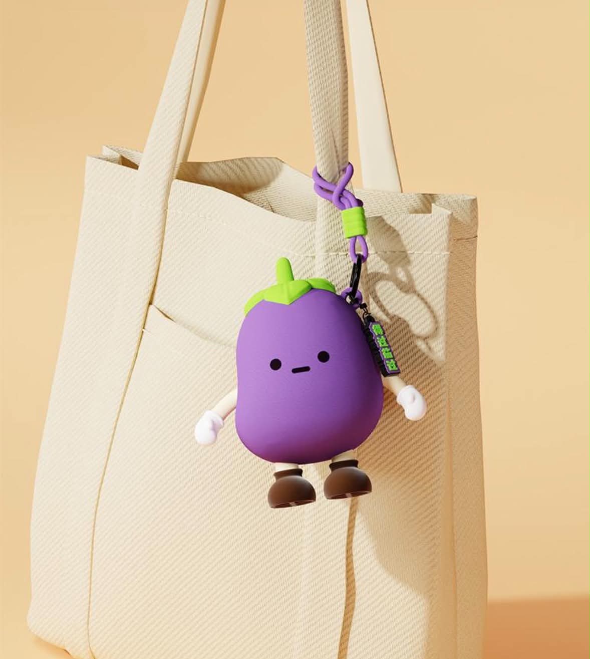 cute little purple aubergine/eggplant 3D coin purse 🍆💜 with the green zip and hanging strap.