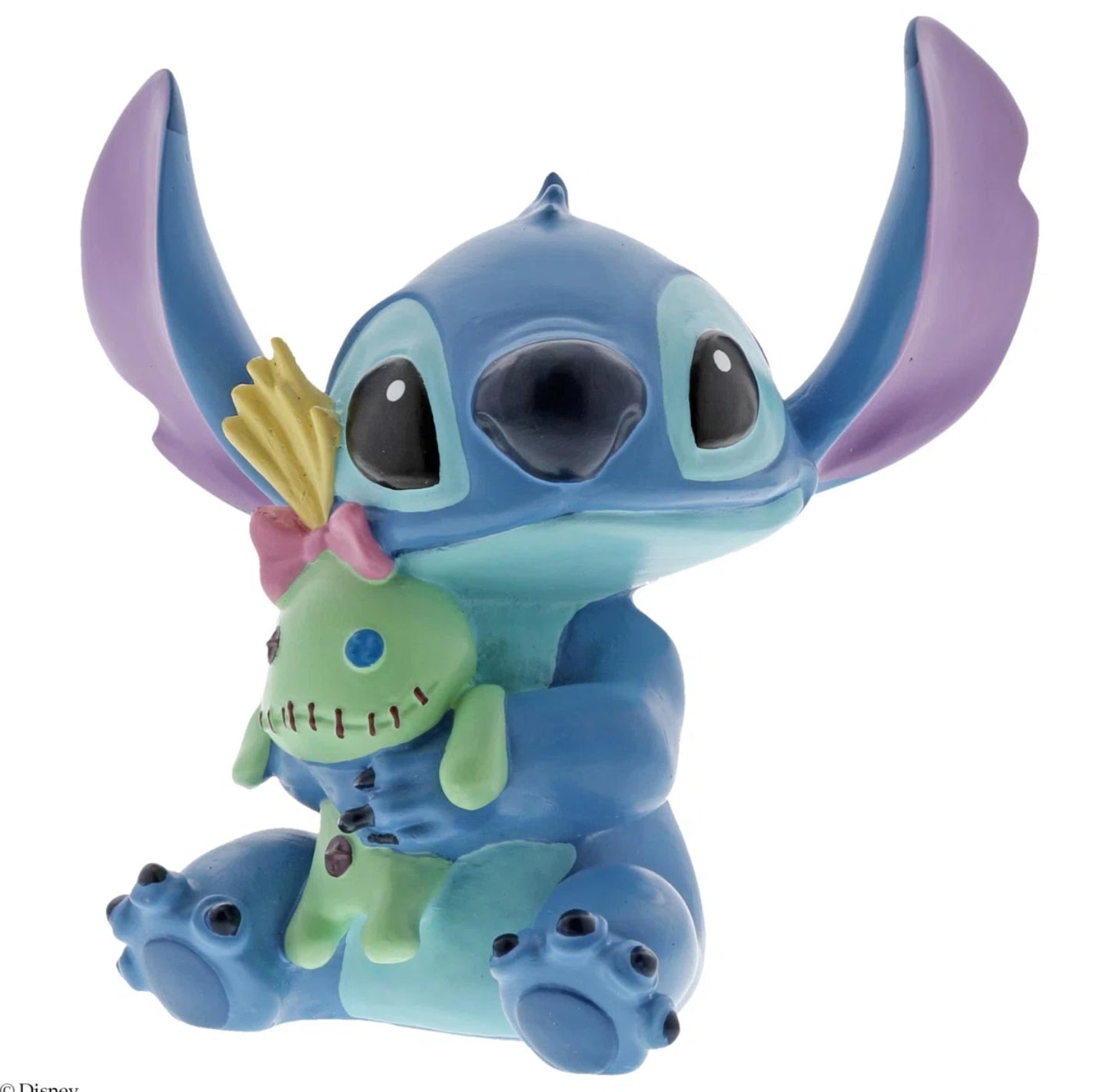Stitch cuddles a scary green ragdoll