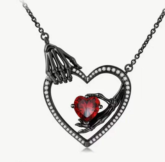 A Dark-Themed Women'S Fashion Necklace Featuring a Gothic Skull Hand Bone Pendant, a Hollow Heart Promise Necklace, a Confession Necklace, And a Red Heart Zirconia Copper Necklace