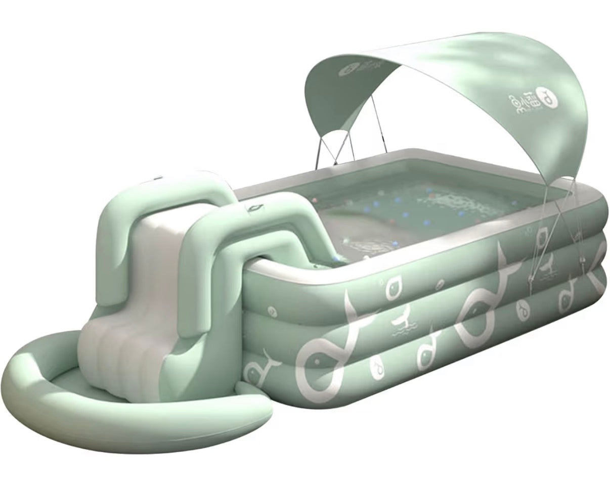 shaded summer swimming pool. The outdoor inflatable swimming pool has a built-in slide. Above ground swimming pools for children and adults. Family entertainment leisure swimming pool.